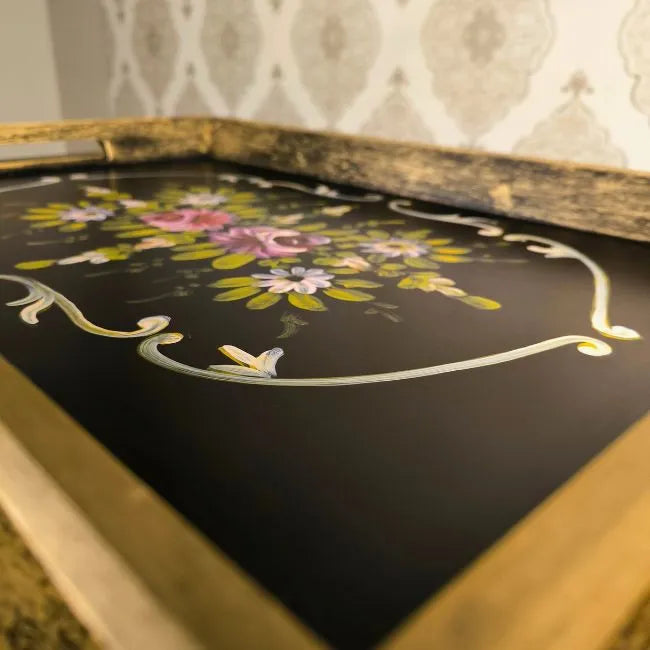 Durable wooden serving cart with floral hand-painted designs, perfect for tea or food.