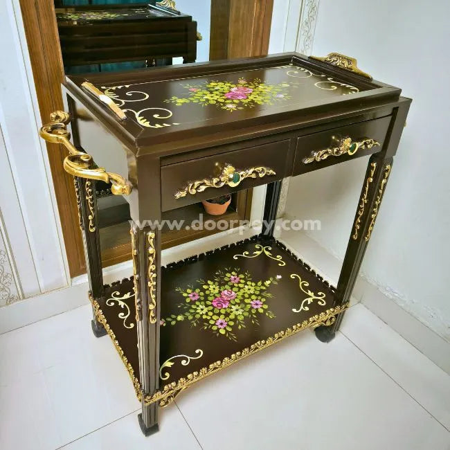 Close-up of hand-painted floral designs on the Floral Dual Delight wooden serving cart.