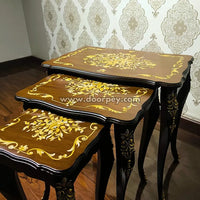 Close up of Francais wooden nesting tables