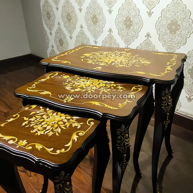 Close up of Francais wooden nesting tables