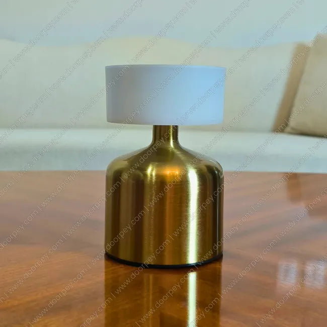 Minimalist Golden Aura cordless table lamp with radiant gold finish for modern home lighting and decor accents