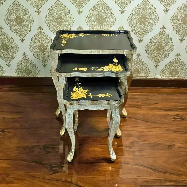 Golden Fern wooden nesting tables placed in a luxurious interior, adding a touch of vintage elegance and charm