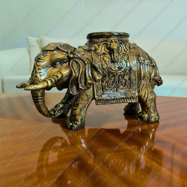 Detailed Golden Maharaja Elephant resin sculpture with radiant gold finish for luxury home decor styling.