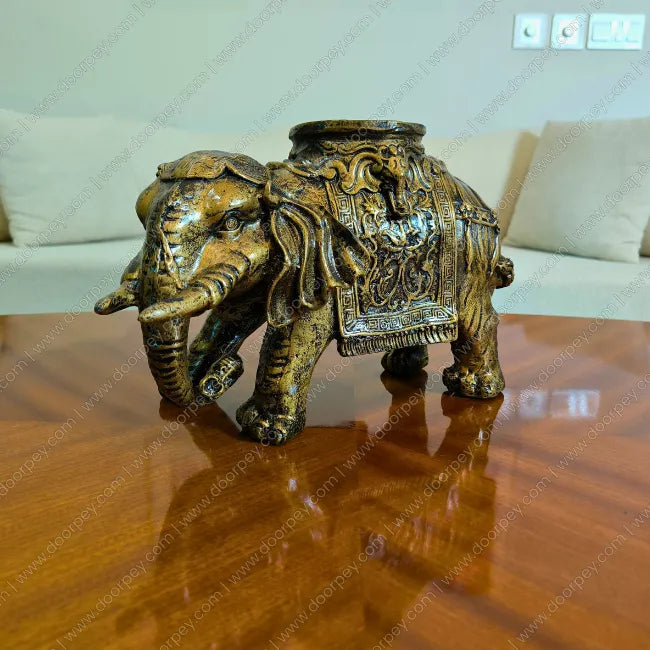 Detailed Golden Maharaja Elephant resin sculpture with radiant gold finish for luxury home decor styling.