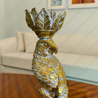Elegant Golden Plume Parrot Candle Stand in Antique Gold finish, a sophisticated resin taper candle holder for luxury home decor styling.