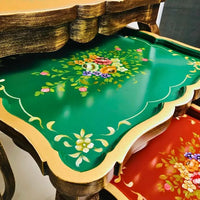 Side view of Harmony Hues wooden nesting tables showcasing elegant curves, floral artistry, and durable Kikar wood construction