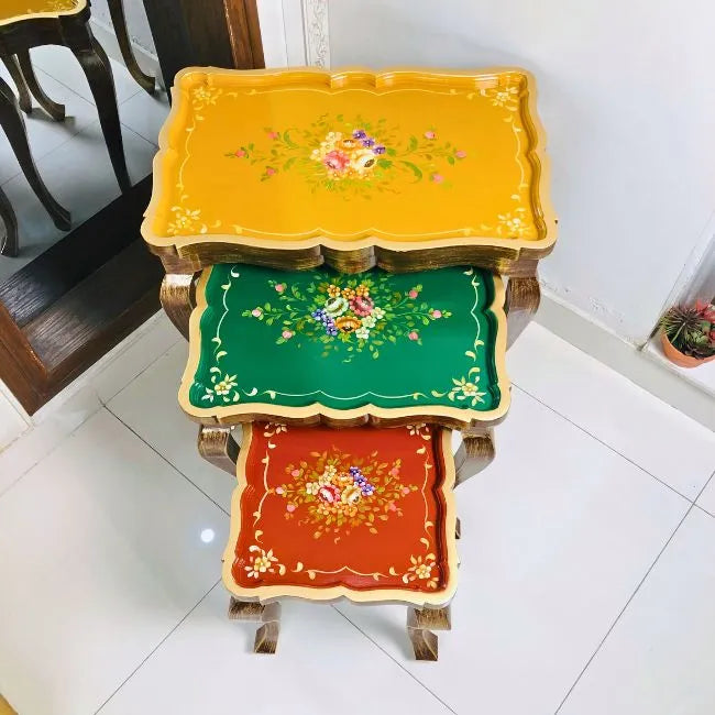 Close-up of Harmony Hues nesting tables, highlighting the intricate hand-painted floral patterns and gold-trimmed edges