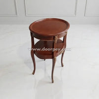 Round antique wooden side table with classic brown finish and decorative gold accents