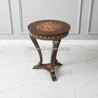 Round wooden side table with intricate hand painted gold pattern and classic curved legs