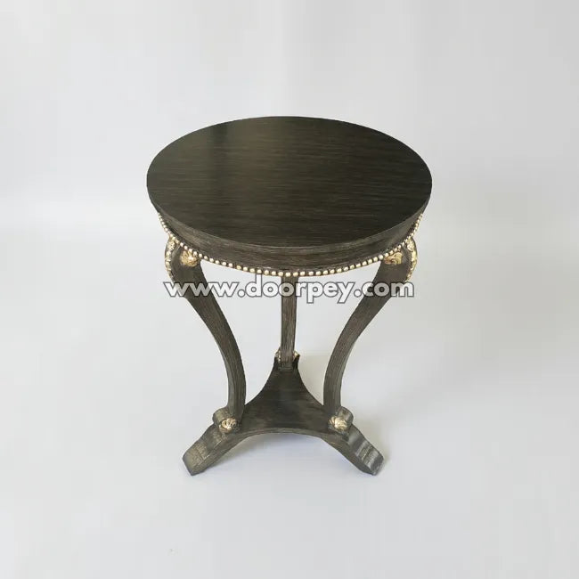 Round wooden side table crafted from kikar wood with decorative detailing and smooth round top