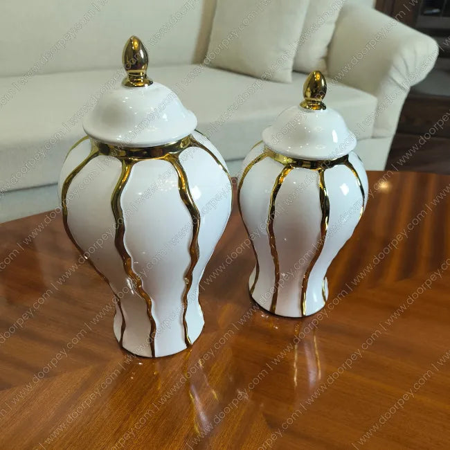 Detailed Royal Ivory Candy Jar Set with a smooth ivory finish, a sophisticated 2-piece ceramic jar collection for elegant home decor styling.