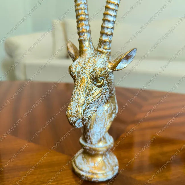 Detailed Royal Savannah Antelope Sculpture with an antique gold finish, a sophisticated resin wildlife figurine perfect for luxury home decor styling.