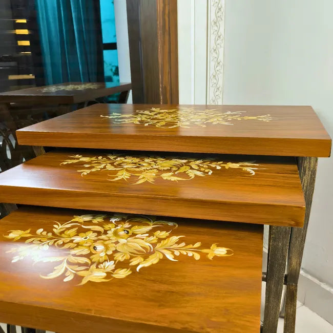Rustic Harmony wooden nesting tables placed in a cozy interior, adding warmth and charm to the space.