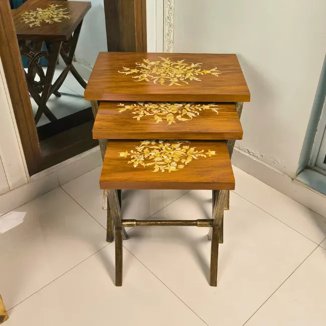 Rustic Harmony wooden nesting table set with hand-painted gold floral designs, crafted from Kikar wood and MDF for a warm and elegant home accent.