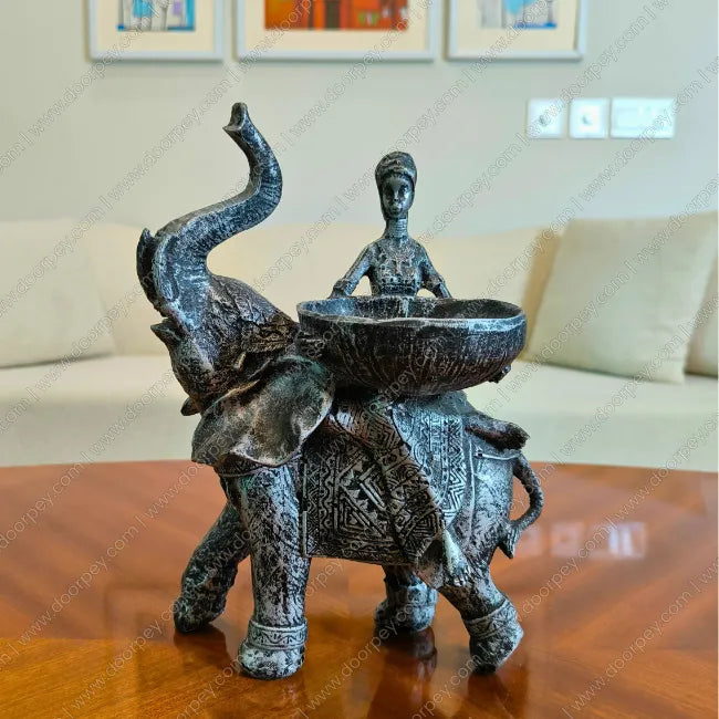 Detailed Savannah Empress Elephant Sculpture with an antique silver finish, a majestic resin elephant and female figure figurine perfect for luxury home decor styling.