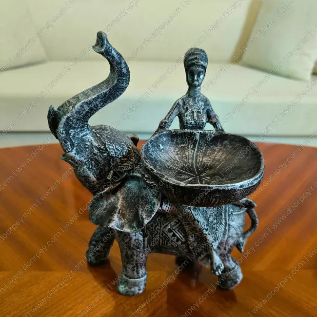 Detailed Savannah Empress Elephant Sculpture with an antique silver finish, a sophisticated resin figurine for luxury home decor styling.