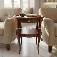 Wooden side table with decorative elements in a living room setting