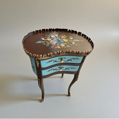 Azure Crest end table with ornate drawers and refined detailing