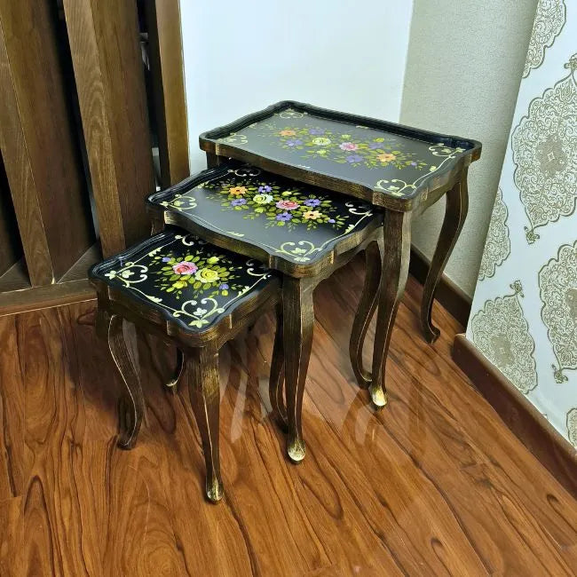 Blossom Breeze wooden nesting tables placed in a stylish interior, adding elegance and functionality with their floral artistry