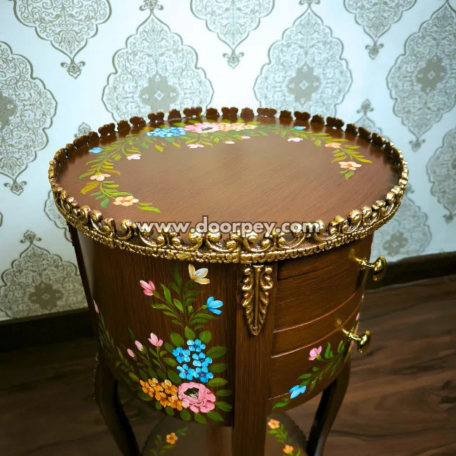 Close up of round hand painted wooden table.