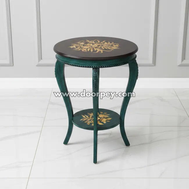 Emerald green round wooden side table with hand painted gold floral pattern and curved legs