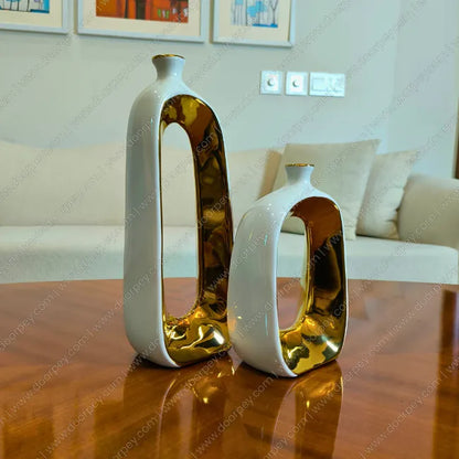 Elegant Golden Halo ceramic donut vase set with white and gold accents for minimalist luxury home decor styling.