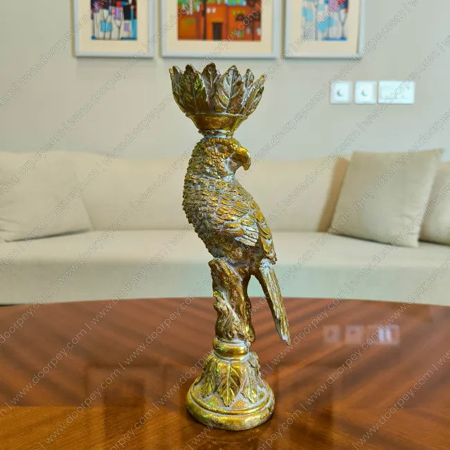 Detailed Golden Plume Parrot Candle Stand with antique gold finish decorative resin parrot for luxury home decor styling.