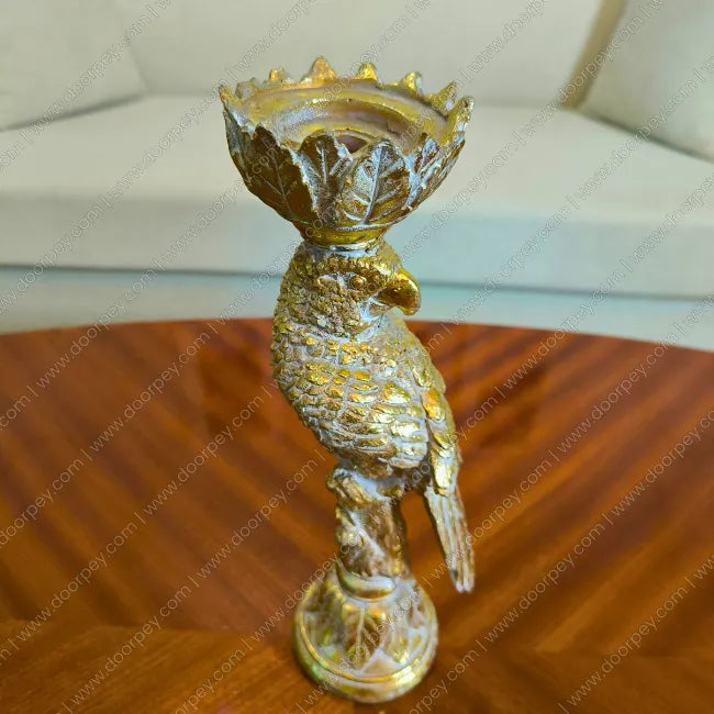 Detailed Golden Plume Parrot Candle Stand with antique gold finish decorative resin parrot for luxury home decor styling.