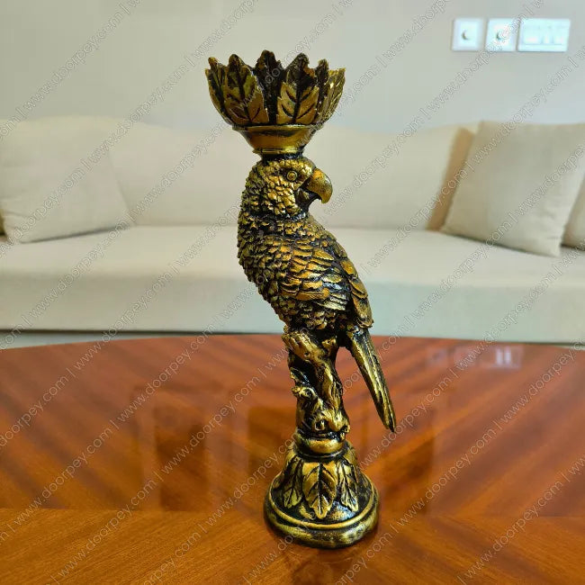 Elegant Golden Plume Parrot Candle Stand in Dark Antique finish, a sophisticated resin taper candle holder for luxury home decor styling.