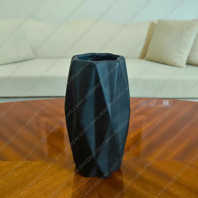 Minimalist Grove Decorative Planter in Matte Black, a sleek ceramic flower pot perfect for modern home decor styling.