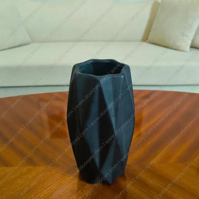 Detailed Grove Decorative Planter in Matte Black ceramic finish for modern indoor plant styling on console tables and shelves.