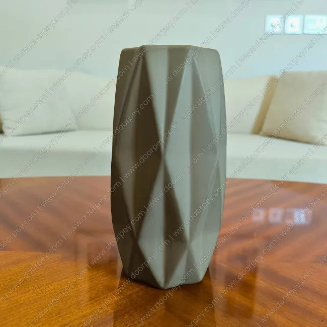 Minimalist Grove Decorative Planter in Stone Grey, a sleek ceramic flower pot perfect for modern home decor styling.