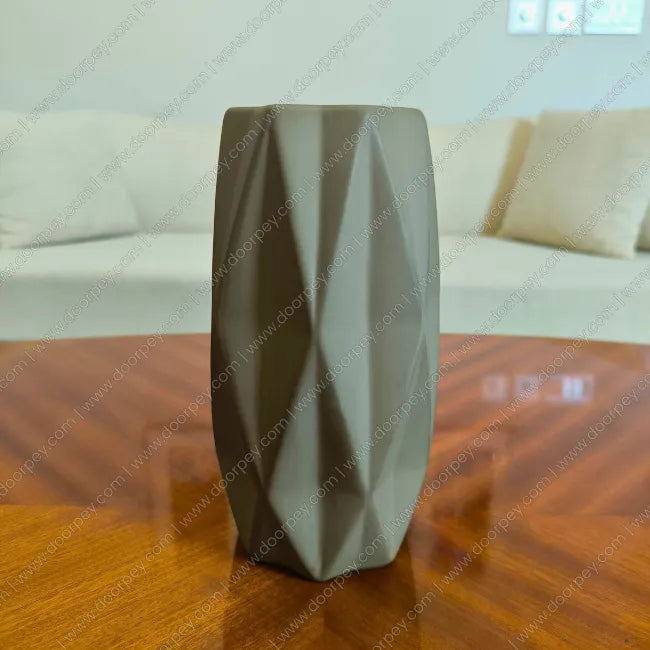 Detailed Grove Decorative Planter in Stone Grey ceramic finish for modern indoor plant styling on console tables and shelves.