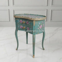 Decorative side table with floral designs on a white background