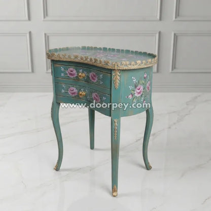 Decorative side table with floral designs on a white background