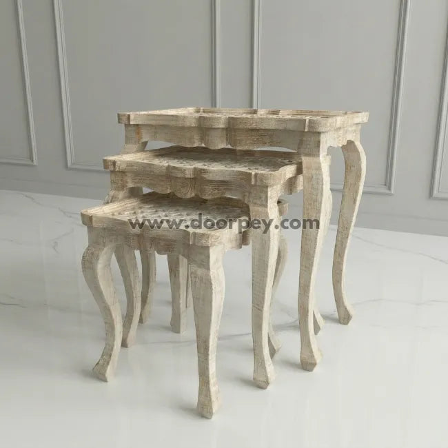 Ivory lattice wooden nesting table used as decorative corner table