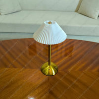 Minimalist Lumière cordless table lamp with a sleek portable design for modern home lighting and decor accents.