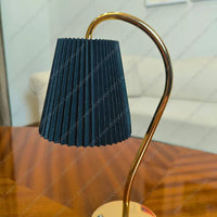 Elegant Lumière Curve Cordless Table Lamp with a radiant gold finish for artistic home decor and ambient lighting.