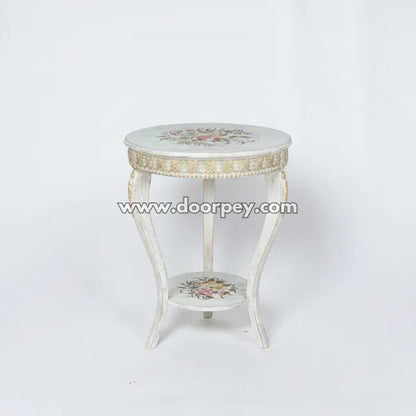 Decorative side table with floral patterns on a white background