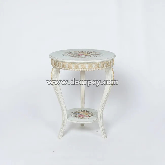 Decorative side table with floral patterns on a white background