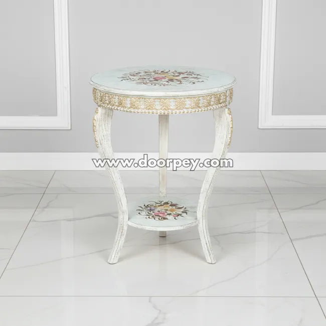 Decorative side table with floral patterns on a white floor and gray wall background