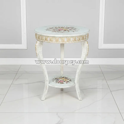 Decorative side table with floral patterns on a white floor and gray wall background