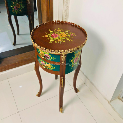 Side profile of a round wooden side table with colorful patterns and gold trims