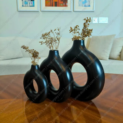 Minimalist Noir Loop Decorative Vase Set, a stunning 3-piece black resin donut vase collection perfect for modern home decor styling.