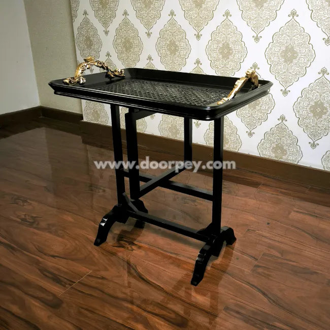 Modern folding serving table with black wooden frame and elegant tray surface