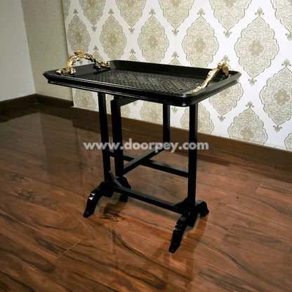 Modern folding serving table with black wooden frame and elegant tray surface