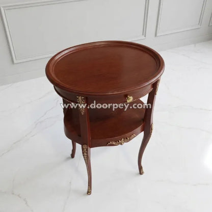 Wooden side table with decorative elements on a white floor and wall background