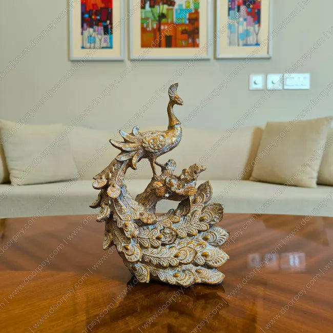 Detailed Royal Peacock resin sculpture with antique gold finish for elegant home decor styling