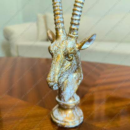 Detailed Royal Savannah Antelope Sculpture with an antique gold finish, a sophisticated resin wildlife figurine perfect for luxury home decor styling.
