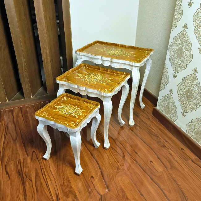 Rustic Ramble wooden nesting table set with hand-painted gold floral designs, crafted from Kikar wood and MDF for a vintage-inspired home accent.